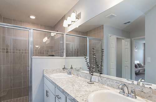 Vanity lighting in owner's bath of Highland Homes' Serendipity model home in Winter Haven, FL