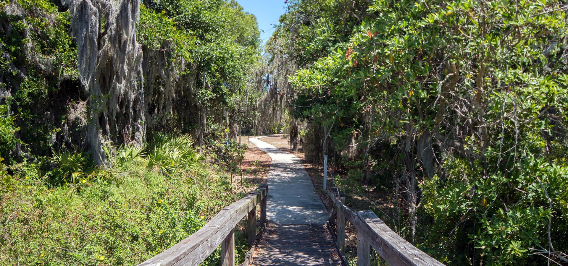 Mackay Gardens and Lakeside Preserve, across the street from homes for sale in Lake Alfred, FL at The Lakes